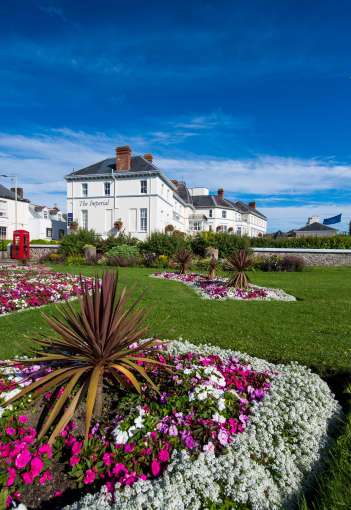 Imperial Hotel Exterior View with Flower Beds